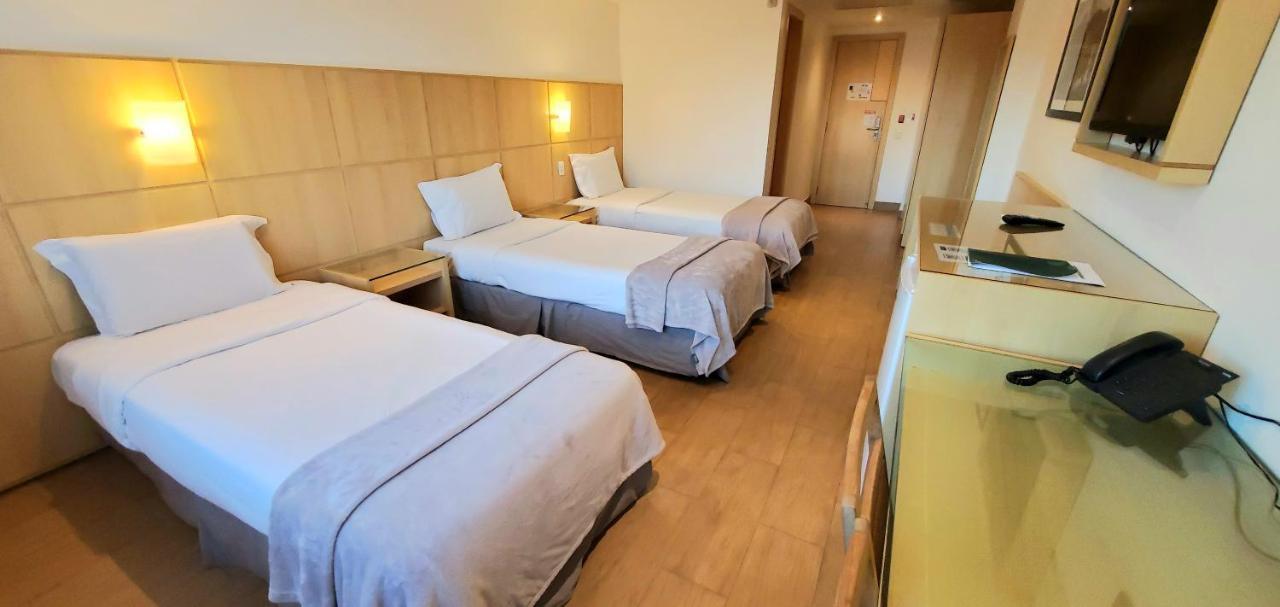 Quarto Triplo com Vista Cidade